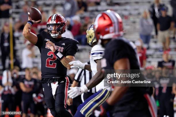 Tayven Jackson of the Indiana Hoosiers throws a pass to DeQuece Carter in the 4th overtime against the Akron Zips at Memorial Stadium on September...