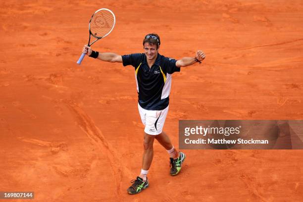 Tommy Robredo of Spain celebrates match point during his Men's Singles match against Nicolas Almargo of Spain during day eight of the French Open at...