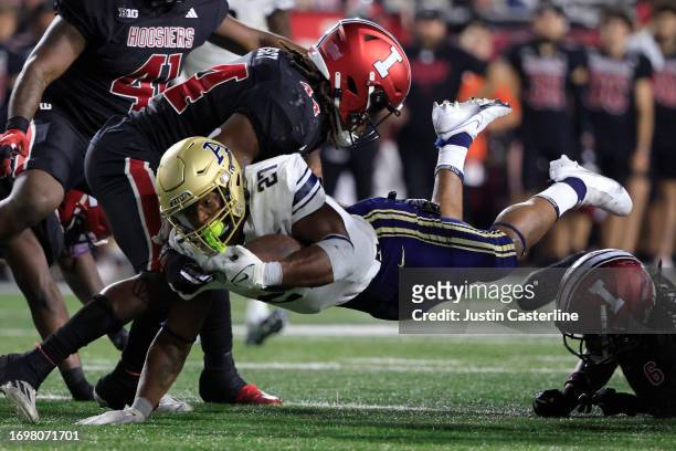 Lorenzo Lingard of the Akron Zips dives for a first down during the on the 4th overtime against the Indiana Hoosiers at Memorial Stadium on September...