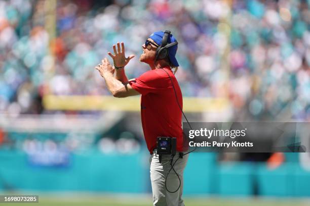 Wide receivers coach Chad Hall of the Buffalo Bills stands on the sideline against the Miami Dolphins during the game at Hard Rock Stadium on...