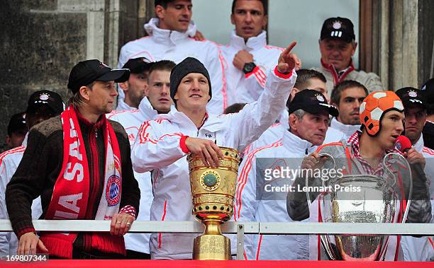 Anatoliy Tymoshchuk, Bastian Schweinsteiger, Jupp Heynckes and Arjen Robben of FC Bayern Muenchen and their teammates celebrate winning the...