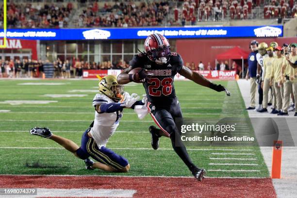 Christian Turner of the Indiana Hoosiers scores a touchdown during the second quarter in the game against the Akron Zips at Memorial Stadium on...