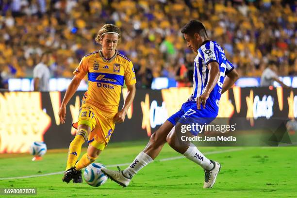 Francisco Cordova of Tigres fights for the ball with Luis Romo of Monterrey during the 9th round match between Tigres UANL and Monterrey as part of...