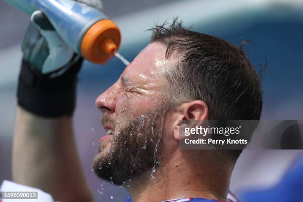 David Quessenberry of the Buffalo Bills sprays water on his face against the Miami Dolphins during the game at Hard Rock Stadium on September 25,...