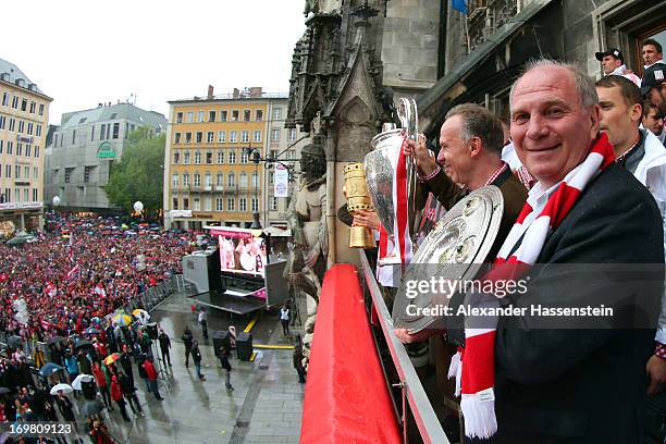 Uli Hoeness , President of FC Bayern Muenchen celebrate winning Bundesliga trophy, Karl-Heinz Rummenigge Champions League winners trophy and Bastian...