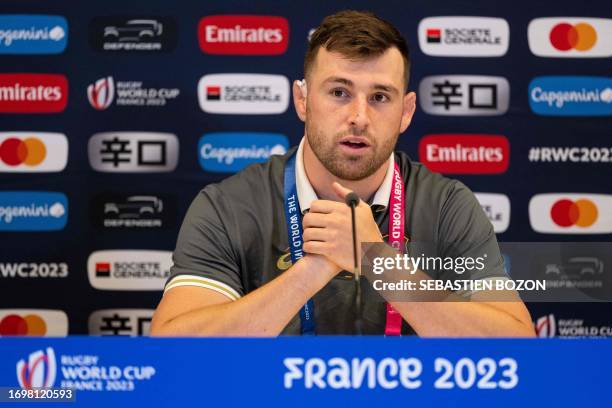 Australia's lock Nick Frost answers questions during a press conference after the captain's run training session at Stade Geoffroy-Guichard in...