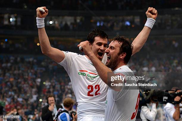 Marcin Lijewski and Igor Vori of Hamburg celebrate the championship after the EHF Final Four final match between FC Barcelona Intersport and HSV...