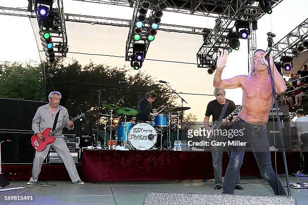 Mike Watt, Scott Asheton, James Williamson and Iggy Pop of Iggy and the Stooges perform in concert during the Free Press Summer Festival at Eleanor...
