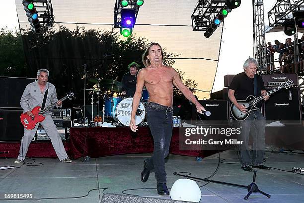 Mike Watt, Scott Asheton, Iggy Pop and James Williamson of Iggy and the Stooges perform in concert during the Free Press Summer Festival at Eleanor...