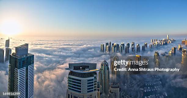 dubai covered with clouds - dubai fog stock pictures, royalty-free photos & images