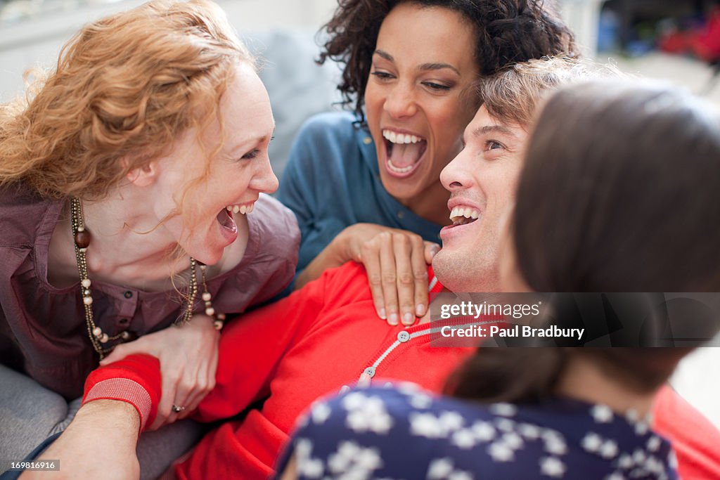 Four friends laughing