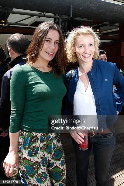 Actresses Zoe Felix and Alexandra Lamy attend Roland Garros Tennis French Open 2013 - Day 8 on June 2, 2013 in Paris, France.