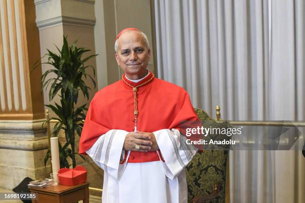 New cardinal Robert Francis Prevost pose for pictures at the end of the consistory during which he received the biretta hat from Pope Francis in St....