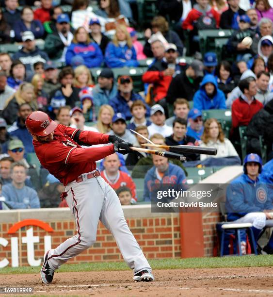 Cody Ross of the Arizona Diamondbacks breaks his bat and flies out against the Chicago Cubs during the fifth inning on June 2, 2013 at Wrigley Field...