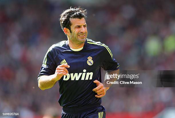 Luis Figo of Real Madrid in action during the match between Manchester United Legends and Real Madrid Legends at Old Trafford on June 2, 2013 in...