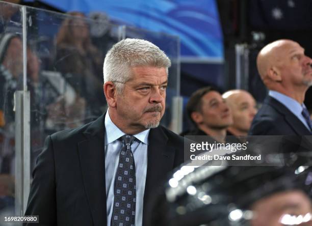 Head coach Todd McLellan of the Los Angeles Kings looks on from the bench area during the first period of the NHL Global Series match between Arizona...