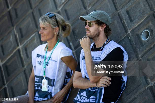 Ex-F1 driver Sebastian Vettel and his press relations manager Britta Roeske watch the F1 Grand Prix of Japan trackside at Suzuka Circuit on September...