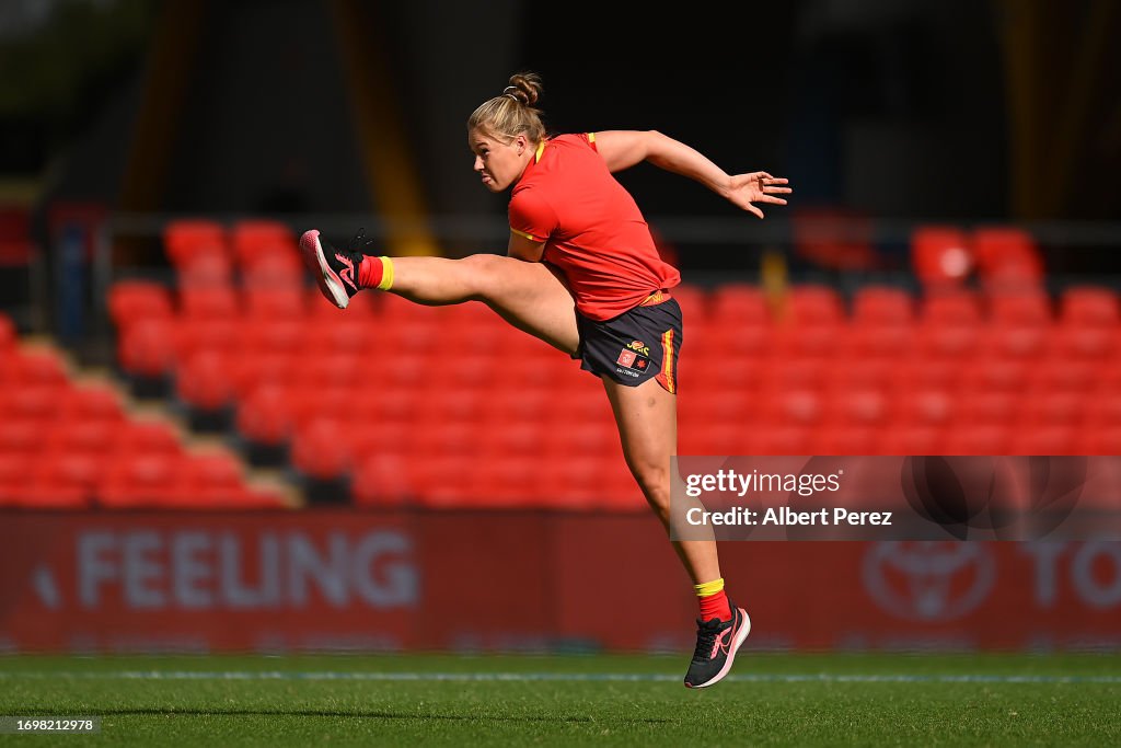 Karl Rowbottom Charlie Rowbottom of the Suns warms up ahead of the round four AFLW ...