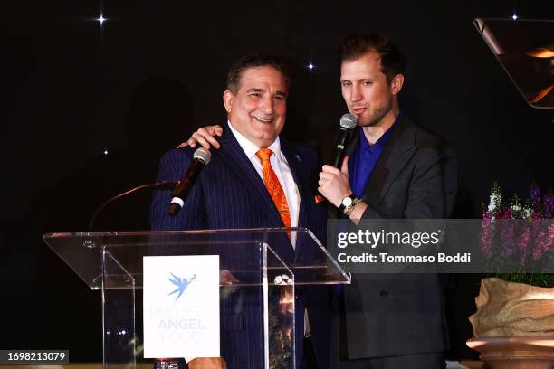 Of Project Angel Food, Richard Ayoub and Gabriel Butu speak onstage during Project Angel Food's 2023 Angel Awards Gala at Project Angel Food on...