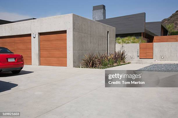 exterior of modern two-car garage - garage doors stock pictures, royalty-free photos & images