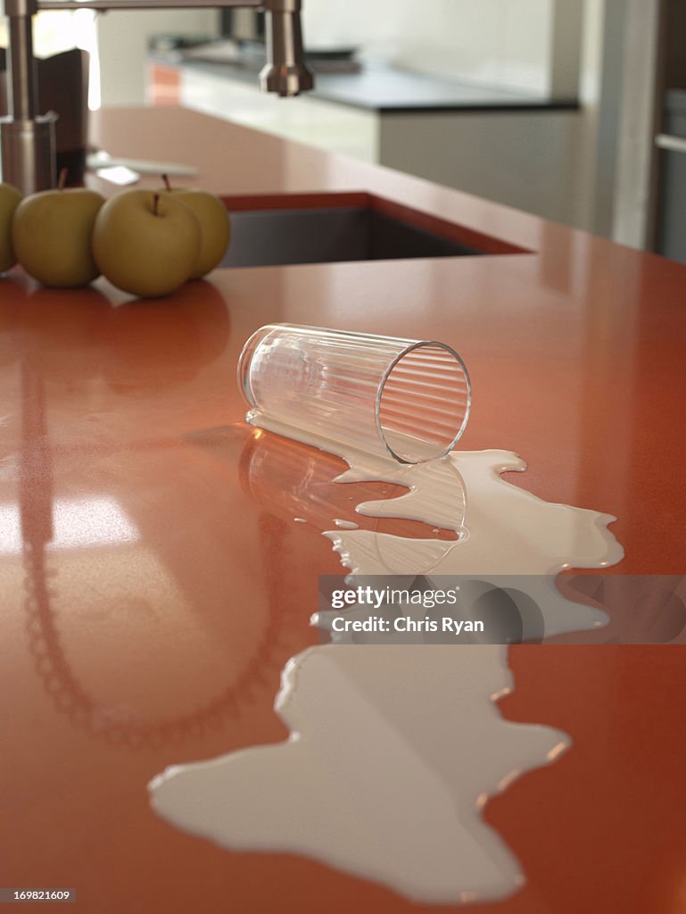 Spilled milk on kitchen counter