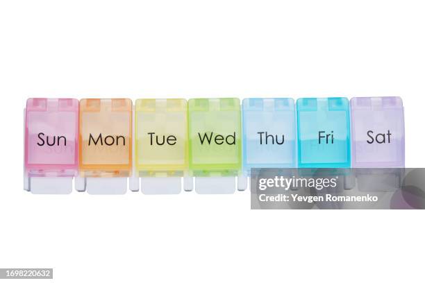 weekly pill organizer, isolated on white background - tablettenschachtel stock-fotos und bilder