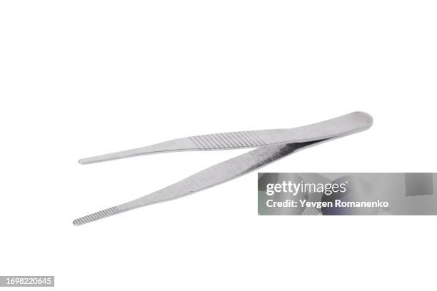 tweezers on white background - tweezer stock pictures, royalty-free photos & images