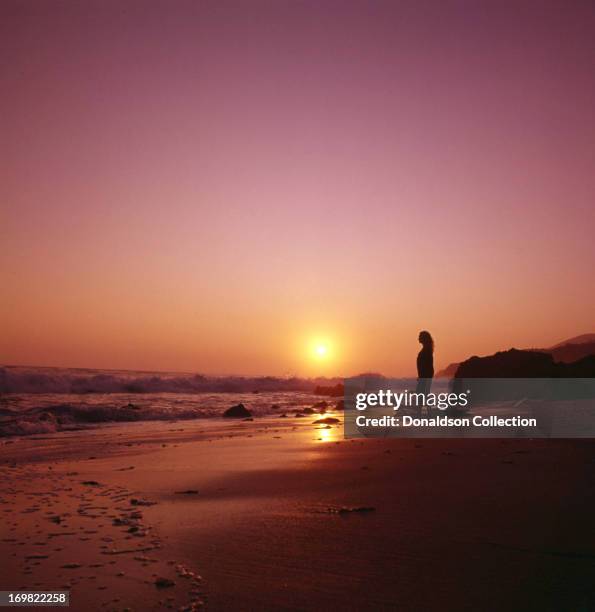 Singer Jackie DeShannon poses for a portrait session on the beach in circa 1964 in Los Angeles, California.