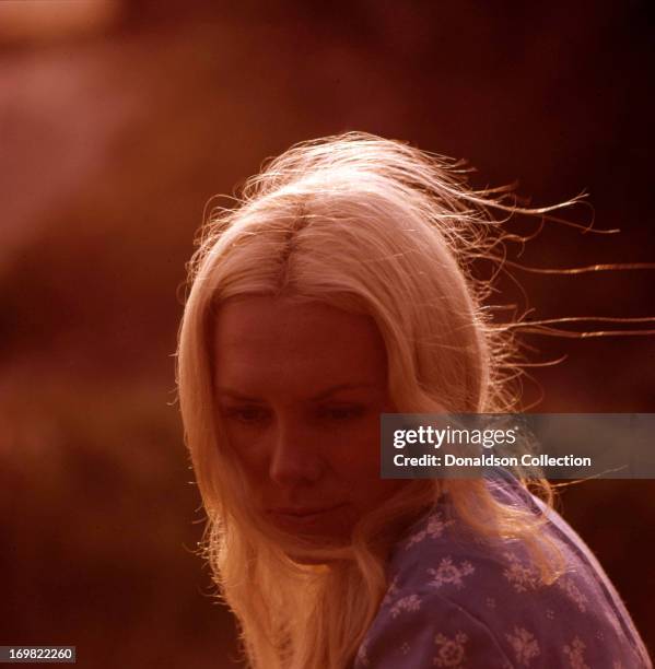 Singer Jackie DeShannon poses for a portrait session on the beach in circa 1964 in Los Angeles, California.