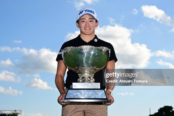 Akie Iwai of Japan poses with the trophy after winning the tournament following the final round of 50th Miyagi TV Cup Dunlop Ladies Open Golf...