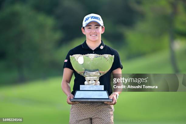 Akie Iwai of Japan poses with the trophy after winning the tournament following the final round of 50th Miyagi TV Cup Dunlop Ladies Open Golf...