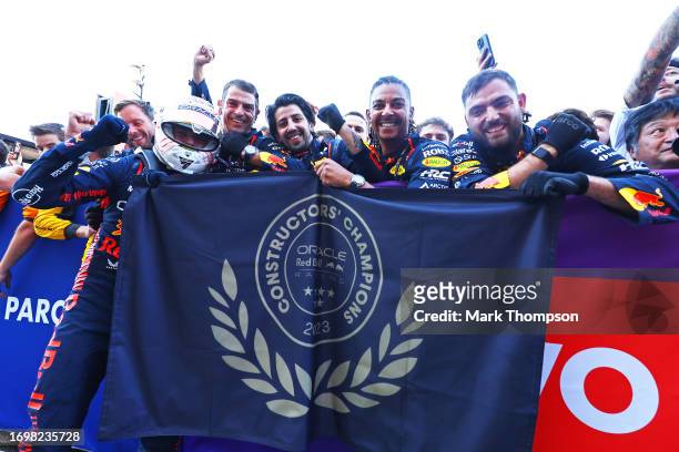 Race winner Max Verstappen of the Netherlands and Oracle Red Bull Racing and his team celebrate their Constructors' Championship win in parc ferme...