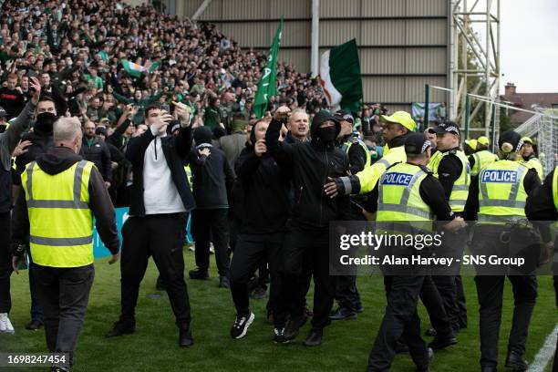 Celtic Fans celebrate the late winner during a cinch Premiership match between Motherwell and Celtic at Fir Park, on September 30 in Motherwell,...