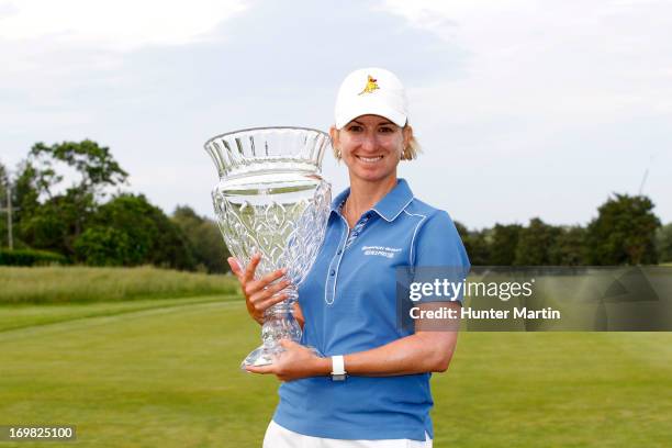 Karrie Webb of Australia holds the championship trophy after winning the ShopRite LPGA Classic Presented by Acer at Stockton Seaview Hotel and Golf...