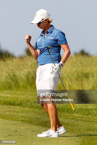 Karrie Webb of Australia reacts after hitting her third shot on the 18th hole during the final round of the ShopRite LPGA Classic Presented by Acer...
