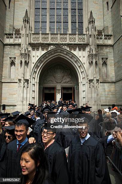 New graduates walk out of the chapel after their commencement at Princeton University in Princeton, New Jersey, U.S., on Sunday, June 2, 2013. Ben S....