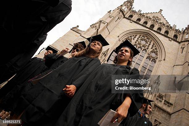 New graduates walk out of the chapel after their commencement at Princeton University in Princeton, New Jersey, U.S., on Sunday, June 2, 2013. Ben S....