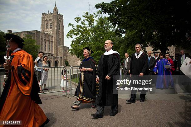 Ben S. Bernanke, chairman of the U.S. Federal Reserve, third from left, walks in a processional with Shirley Tilghman, president of Princeton...