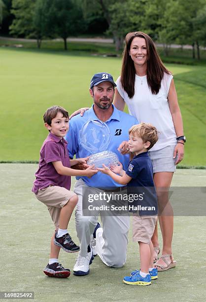 Matt Kuchar poses with his wife Sybi and sons Cameron and Carson alongside the trophy after his two-stroke victory at the Memorial Tournament...