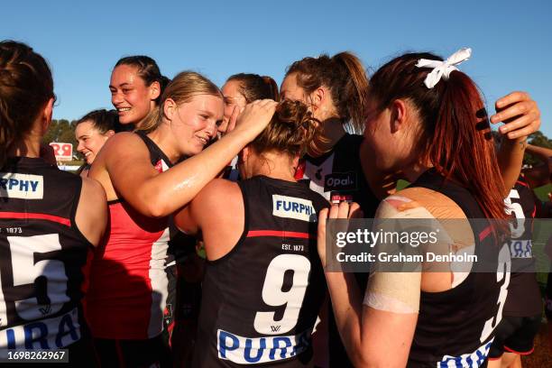 The Saints celebrate victory in the round four AFLW match between St Kilda Saints and Collingwood Magpies at RSEA Park, on September 24 in Melbourne,...