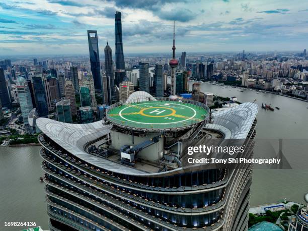 white magnolia plaza building complex and helipad aerial view, shanghai, china - helipad stock pictures, royalty-free photos & images
