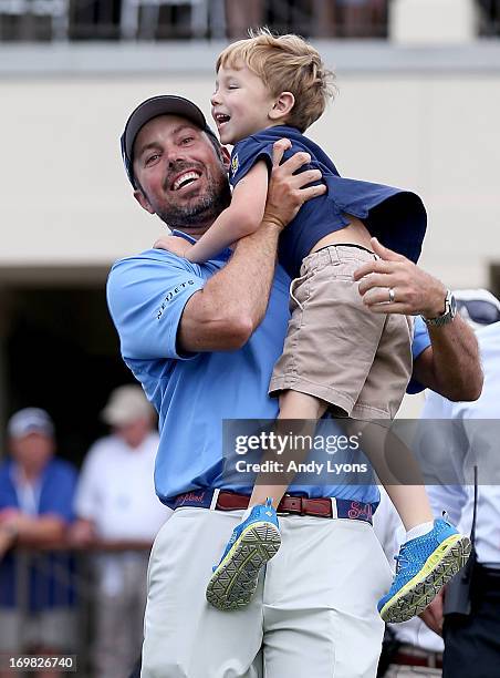 Matt Kuchar celebrates with son Carson after he won the Memorial Tournament presented by Nationwide Insurance at Muirfield Village Golf Club on June...