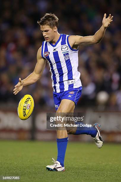 Andrew Swallow of the Kangaroos kicks the ball during the round ten AFL match between the North Melbourne Kangaroos and the St Kilda Saints at Etihad...