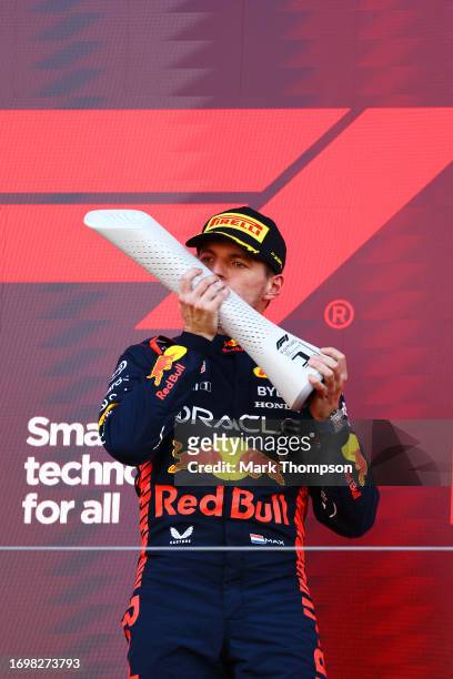 Race winner Max Verstappen of the Netherlands and Oracle Red Bull Racing celebrates on the podium during the F1 Grand Prix of Japan at Suzuka...