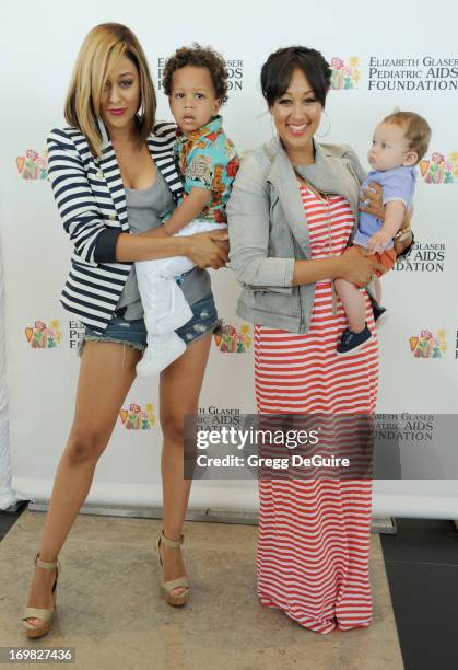 Actress Tia Mowry-Hardrict, son Cree Hardrict, actress Tamera Mowry-Housley and son Aden Housley arrive at the Elizabeth Glaser Pediatric AIDS...