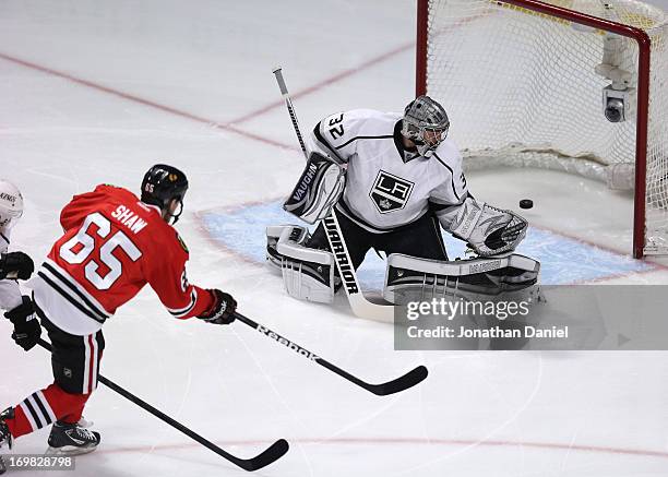 Andrew Shaw of the Chicago Blackhawks scores a goal in the first period of Game Two of the Western Conference Final past goaltender Jonathan Quick of...