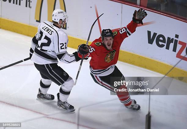 Andrew Shaw of the Chicago Blackhawks celebrates his goal in the first period of Game Two of the Western Conference Final as Trevor Lewis of the Los...