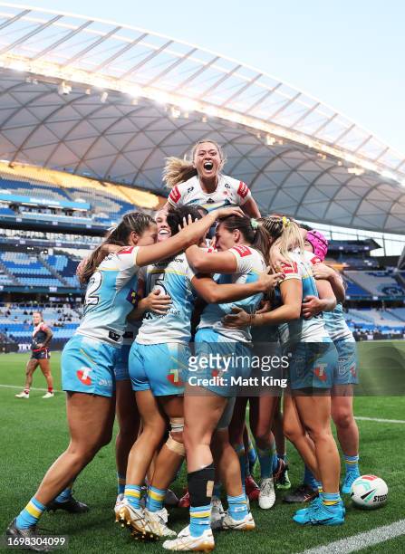 Destiny Mino-Sinapati of the Titans celebrates with team mates after scoring a try during the NRLW Semi Final match between Sydney Roosters and Gold...