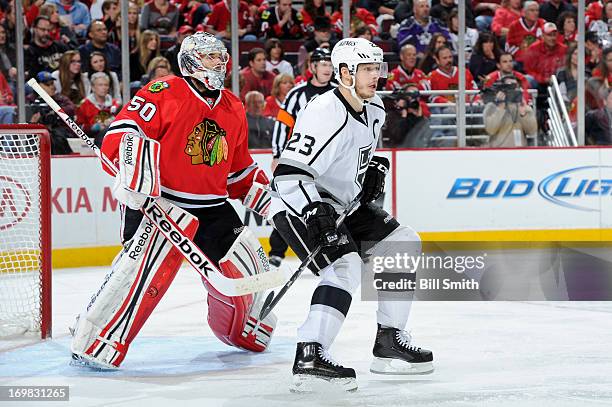 Dustin Brown of the Los Angeles Kings gets position in front of Goalie Corey Crawford of the Chicago Blackhawks in Game Two of the Western Conference...