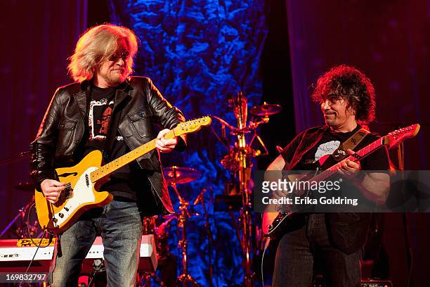 Daryl Hall and John Oates of Hall & Oates perform at the Ryman Auditorium on June 2, 2013 in Nashville, Tennessee.